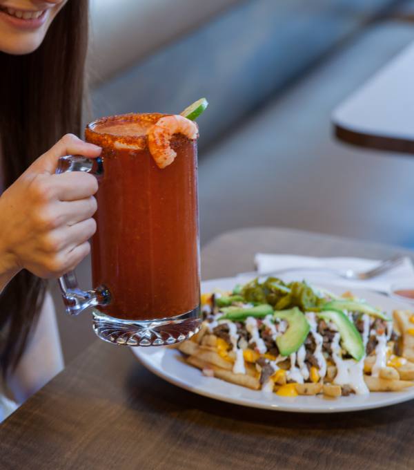 Michelada with shrimp and loaded fries with carne asada served at the restaurant.